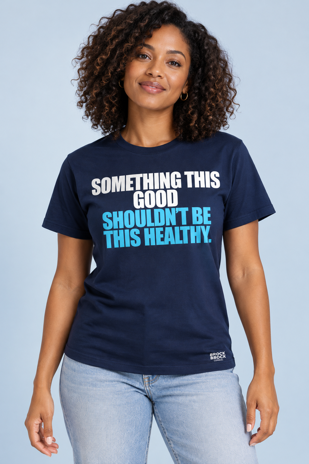 Black female model wearing our navy Something this good shouldn’t be this healthy T-shirt with white and sky blue lettering